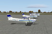 A fleet of Cessna 172's on the ground.