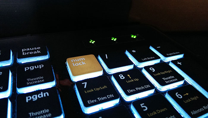 Indicator lights shaped like the Editors Keys logo/Colored Num Lock button changes the function of the number keys.