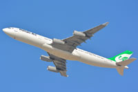 Looking up at an Iran Airbus A340-300 in flight.