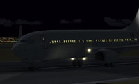 Screenshot of Boeing 737-400 on the runway at night.