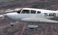 Close up of Piper Cherokee 180 TI-AHQ in flight.