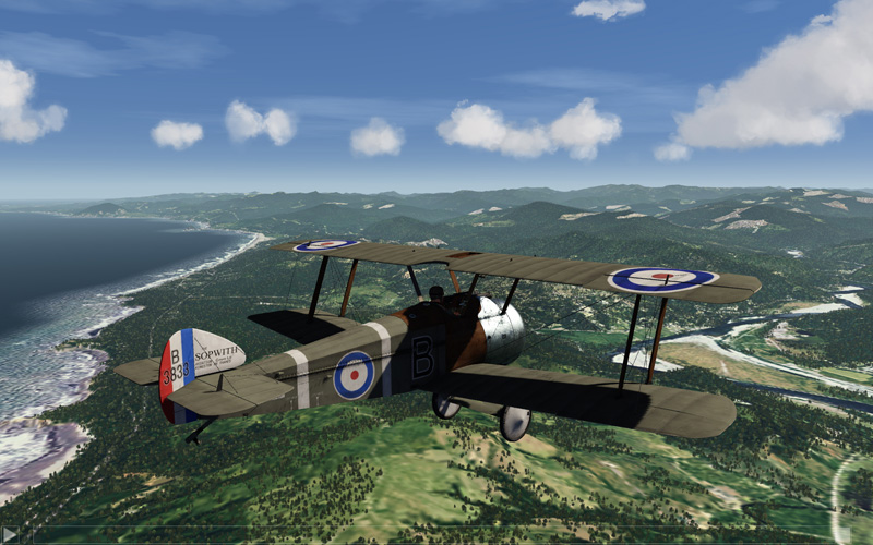 WW2 Biplane over scenery.