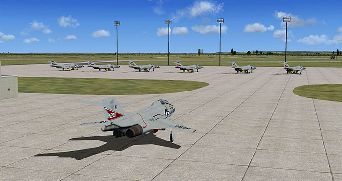 Military aircraft lined up on ramps