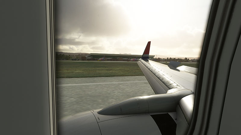 Shot showing aircraft wing out of the window taking off from Skopje in MSFS.