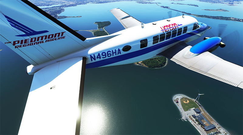 The Beech Model 99 add-on in flight over the coastline in Microsoft Flight Simulator.