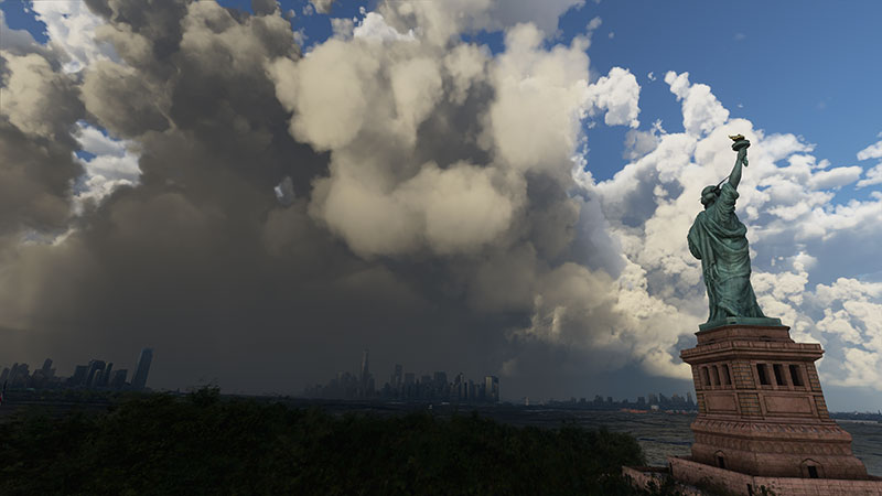 Massive clouds (volumetric) and Statue of Liberty displayed in Microsoft Flight Simulator.
