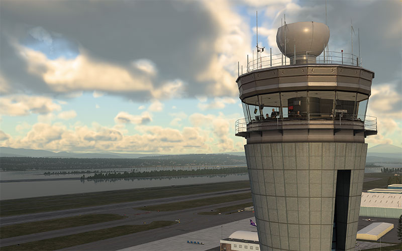 Control tower and epic weather in background in X-Plane 12.