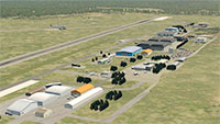 Aerial view of the runway and several hangers.