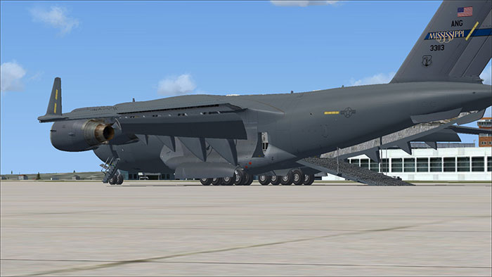 Aircraft with rear cargo doors open.