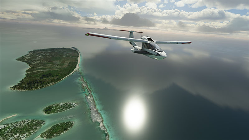 Icon A5 in flight over islands.