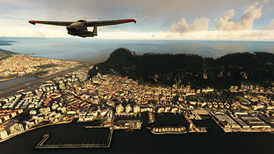 Image shows an Icon A5 flying over Gibraltar with the airport in the background after installing this freeware scenery mod in MSFS.