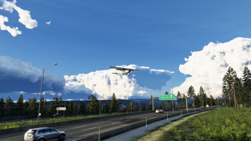 Flying over the local highway in approach to KBLU in XP12.