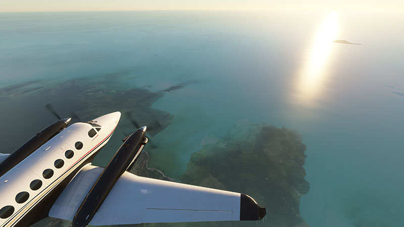 King Air 350i flying over islands.