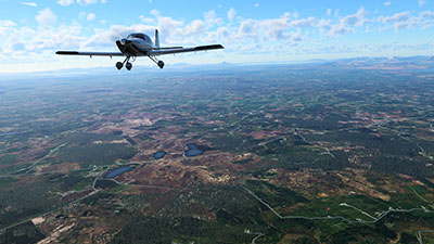 Image shows a light aircraft flying over Ireland after installing this scenery pack in the latest X-Plane 12.