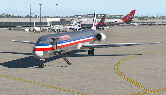 MD80 on ground with passenger stairs deployed.