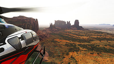 Screenshot shows helicopter flying over Monument Valley after installing the freeware scenery mod available in this section.