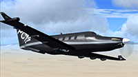 Black PC-12 in flight.