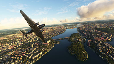 A DC-3 flying over Stockholm city in Microsoft Flight Simulator after installing the scenery mod.