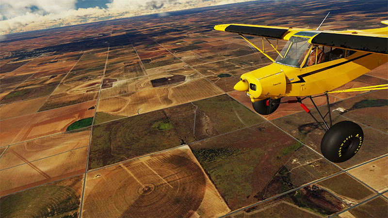 Aircraft flying over fields in Texas, USA.