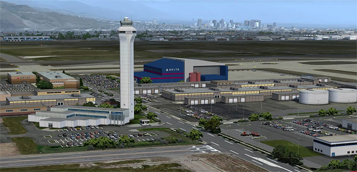 Control tower with city in background.