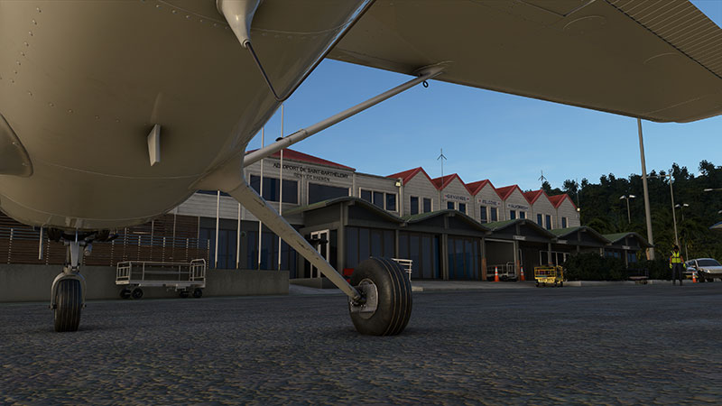 Under the tailplane with landing gear visible.  At Saint Barthélemy Airport.