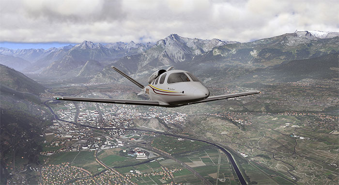 Cirrus Vision flying over mountainous region.