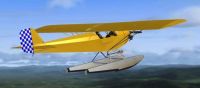 Piper Cub On Floats in flight.