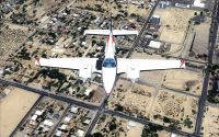 Double engine private aircraft flying over West Texas.