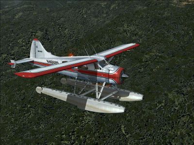 Red And Black DHC-2 Beaver in flight.