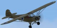 Air Force J-3 Cub in flight.