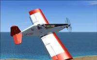 Red and white Ayres Turbo Thrush in flight.