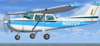 Blue And White Cessna 172SP in flight.