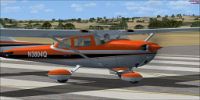 Orange Cessna Skyhawk 172 on runway.