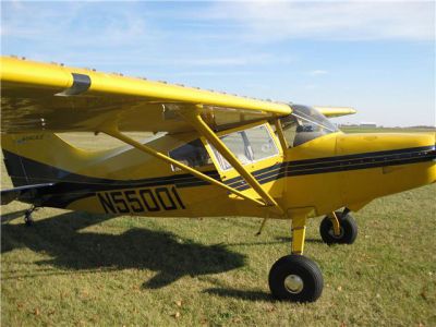 Photograph of a yellow and blue Maule 260C.