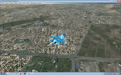 Screenshot of plane flying over towns.