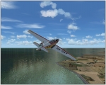 Zlin flying over coast